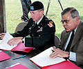 Commissioner Nassberg and Lt. Colonel JT Hand sign the Federal Agreements to initiate the Study